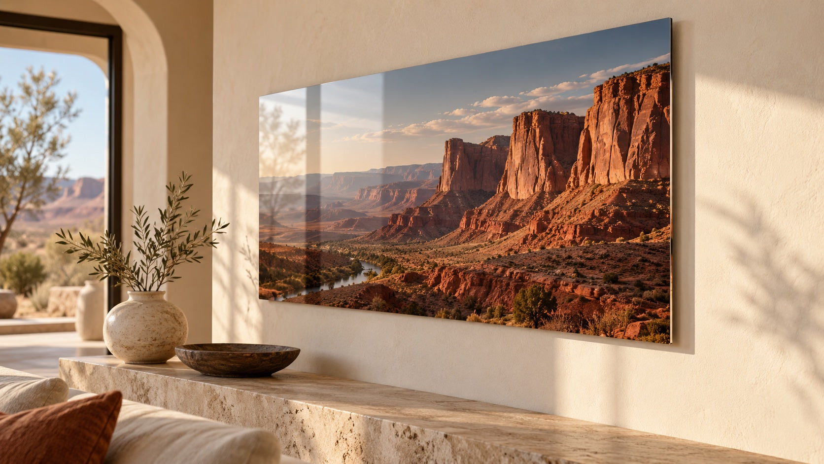 A desert cliff metal print catching afternoon light on an ivory wall