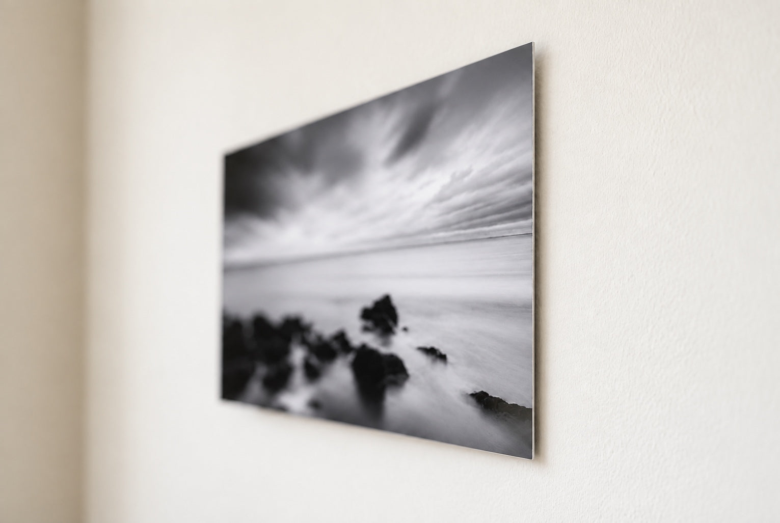 close-up of a thin silver metal print edge and corner