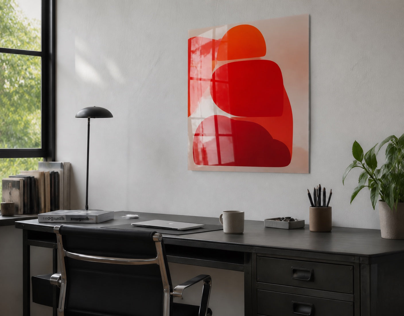 A metal print displayed above a workspace